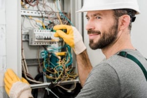 electrician repairing electrical box