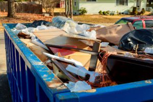 Over flowing Dumpsters being full with garbage